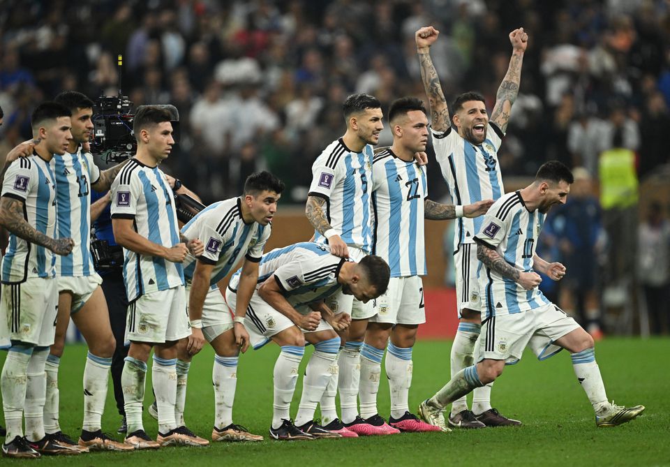 Soccer Football - FIFA World Cup Qatar 2022 - Final - Argentina v France - Lusail Stadium, Lusail, Qatar - December 18, 2022 Argentina players react during the penalty shootout REUTERS/Dylan Martinez