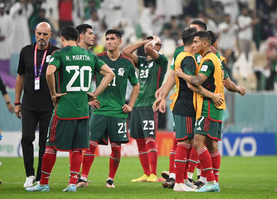 Soccer Football - FIFA World Cup Qatar 2022 - Group C - Saudi Arabia v Mexico - Lusail Stadium, Lusail, Qatar - December 1, 2022 Mexico's Henry Martin, Uriel Antuna and Jesus Gallardo look dejected after the match as Mexico are eliminated from the World Cup REUTERS/Alberto Lingria