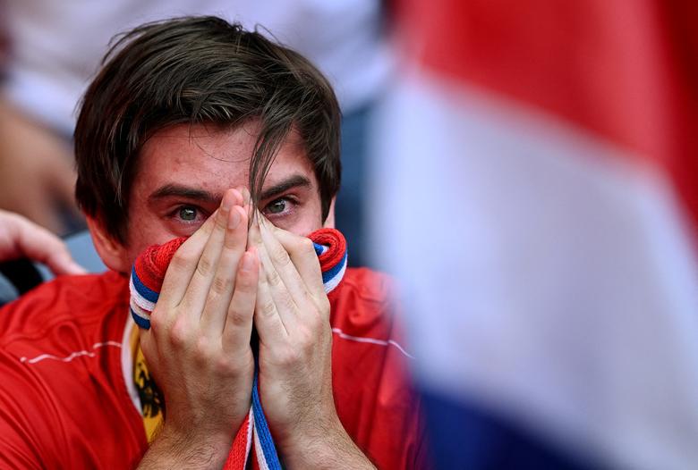 A Costa Rica fan reacts after their match against Japan. REUTERS/Dylan Martinez