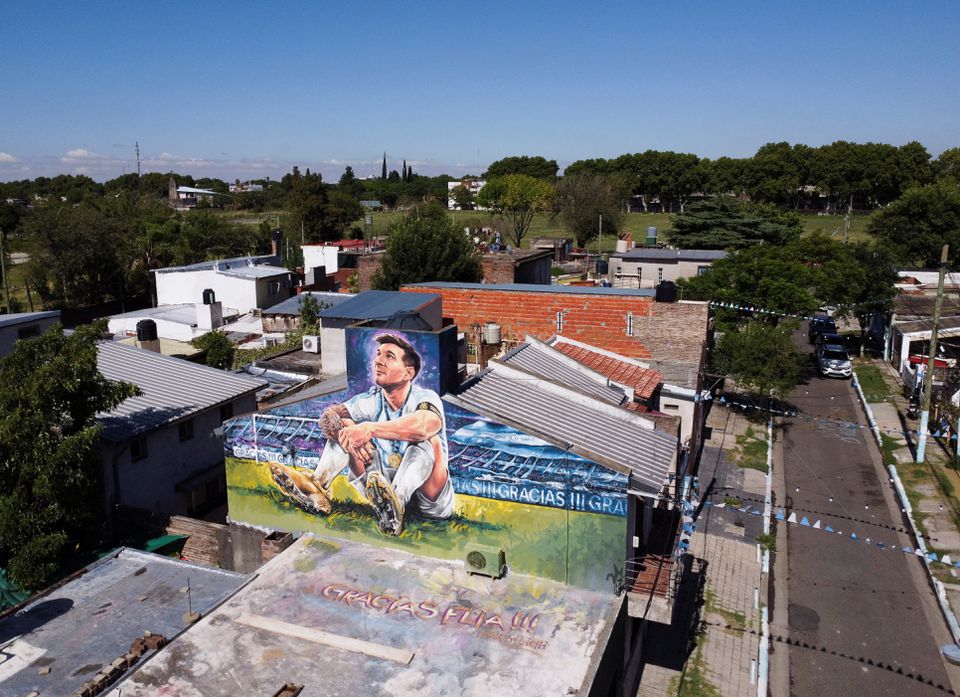 A mural depicting Argentine soccer star Lionel Messi is seen on top of the home where he was born, in Rosario, Argentina December 15, 2022. REUTERS/Agustin Marcarian